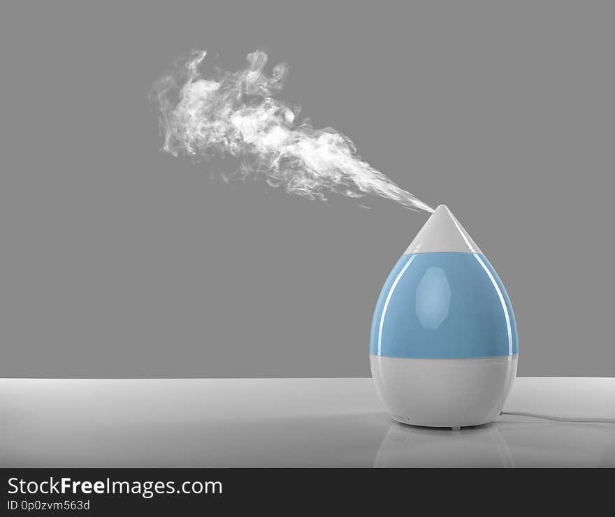 White-blue air humidifier. The unique design quickly and effectively eliminates dry air, providing an optimal level of humidity in the room.