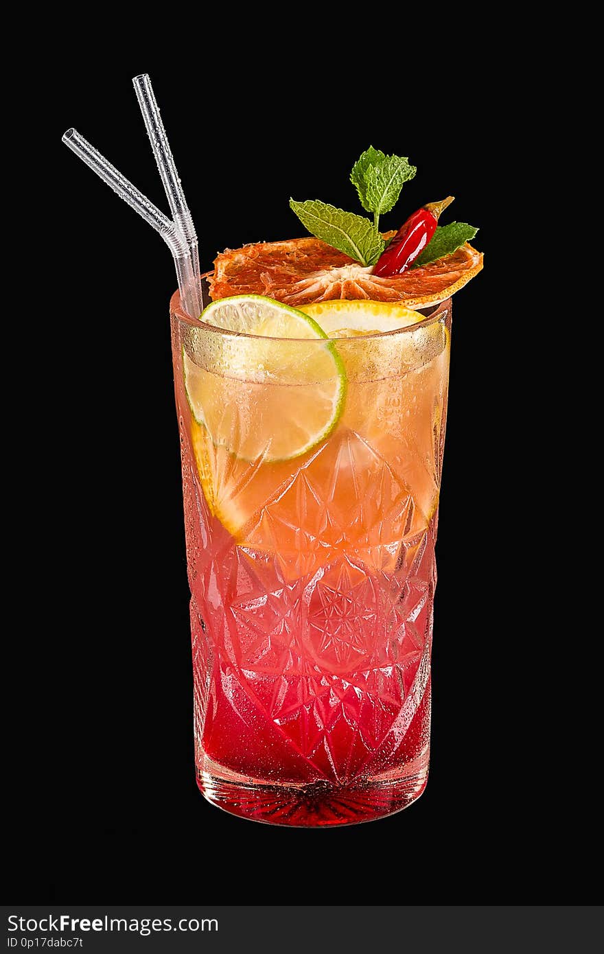 Spicy tropical alcohol cocktail with orange, lime and mint on black background with clipping path. Spicy tropical alcohol cocktail with orange, lime and mint on black background with clipping path