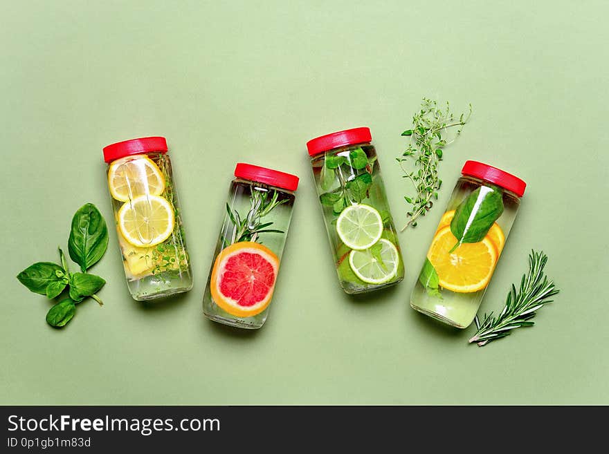 Fruits and culinary herbs bottled infused water, flat lay composition. Fruits and culinary herbs bottled infused water, flat lay composition