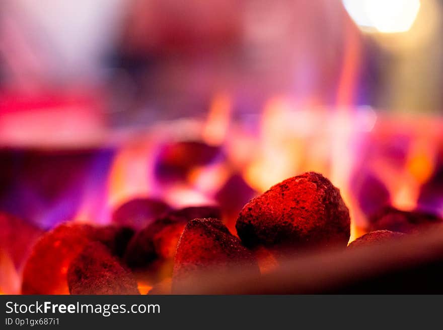 Flaming coals hot rocks with multicolored flames for barbeque, tikka, kebabs. These allow for these delicacies to be created indoors, or in camp sites