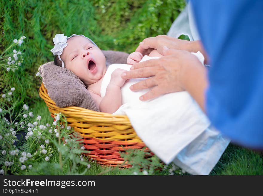 Asian newborn. Lovely kid and little child of parent. Mom with baby. Lifestyle of new family with love