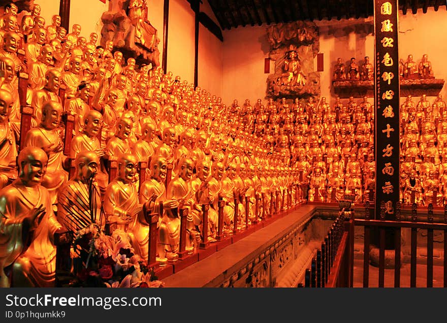 Golden statues of Buddha in buddist temple in China