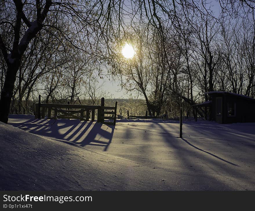 The shadow of a wooden fence