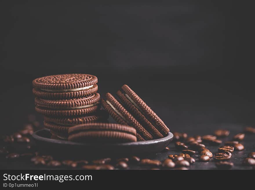 Chocolate chips cookies on black background. Matte toned