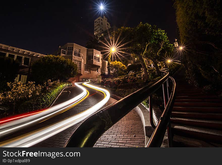 Car trails at night at Lomard Street, San Francisco