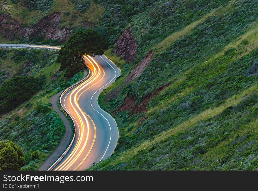 Long exposure car trails on windy mountain road