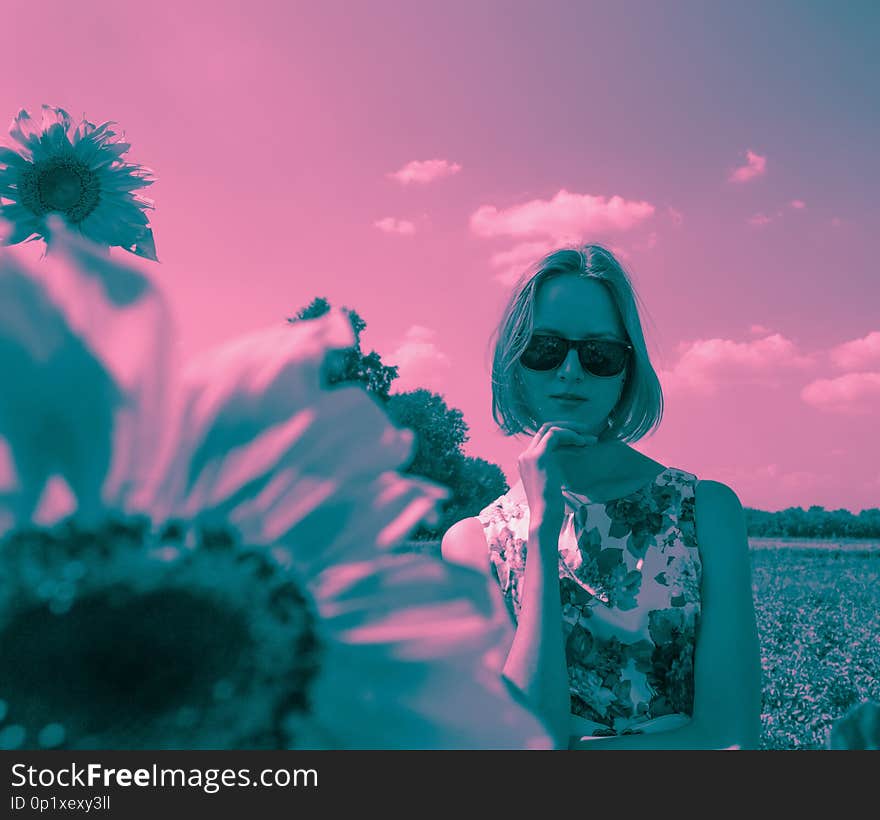 Duotone portrait of young woman in sunglasses