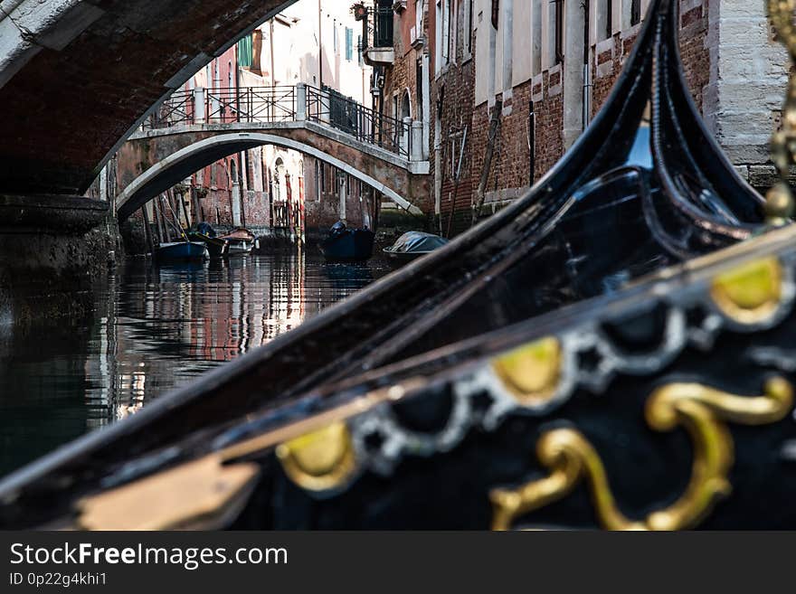 A vew from a Venetian Gondola as it navigates the back canals of Venice. A vew from a Venetian Gondola as it navigates the back canals of Venice