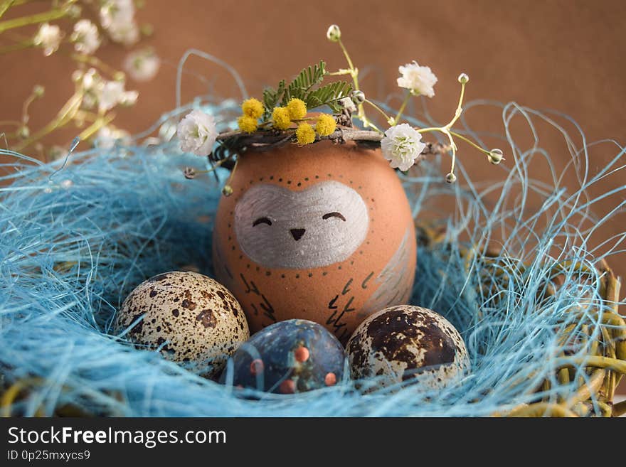 Easter holiday concept with cute handmade eggs, rabbit, chicks, owl, panda and deer. Creative eggs for Easter.