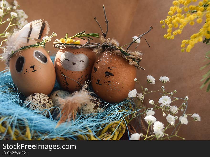 Easter holiday concept with cute handmade eggs, rabbit, chicks, owl, panda and deer. Creative eggs for Easter. Happy easter