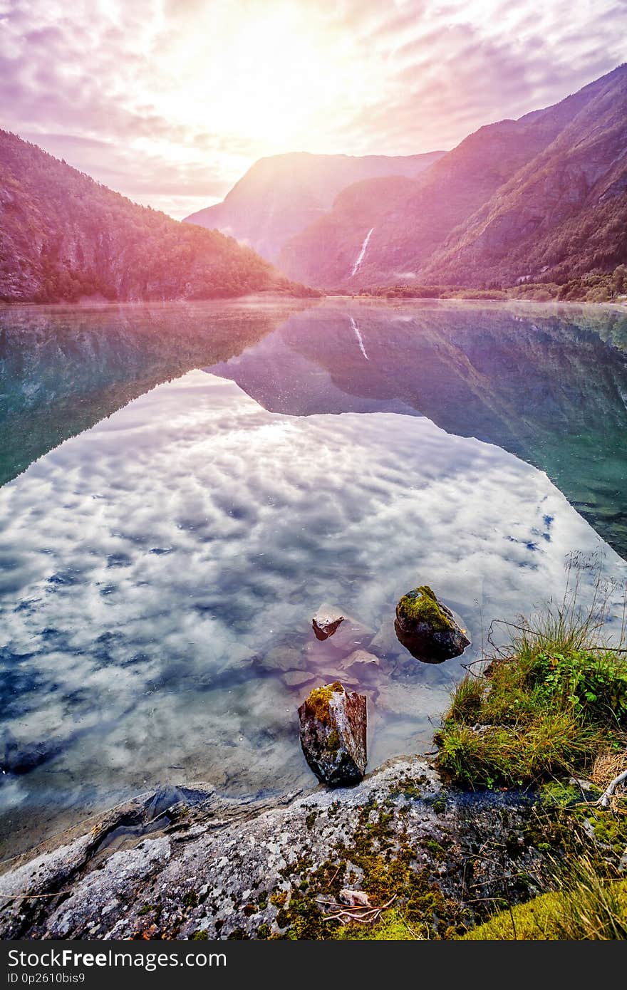 Amazing nature view with fjord and mountains. Beautiful reflection. Location: Scandinavian Mountains, Norway.