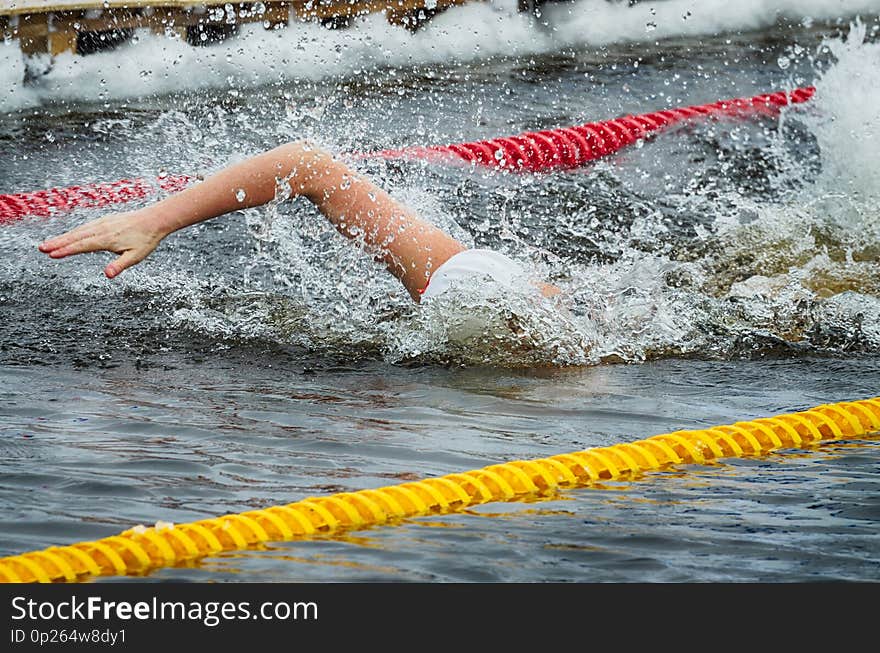 Lovers of winter swimming.Swimmer swims in the pool.He swims the distance at speed