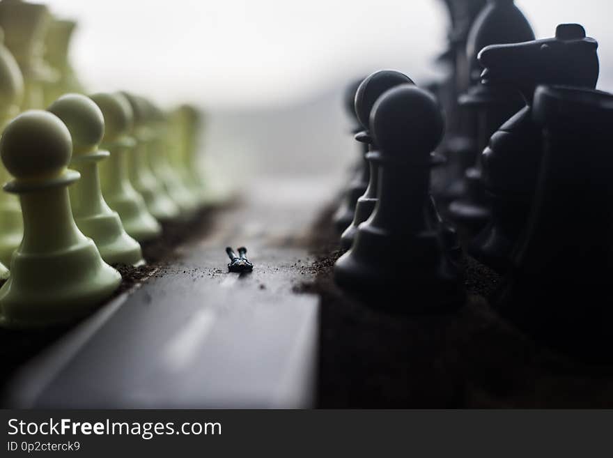 Chess board game concept of business ideas and competition and strategy ideas concep. Chess figures on a dark background with