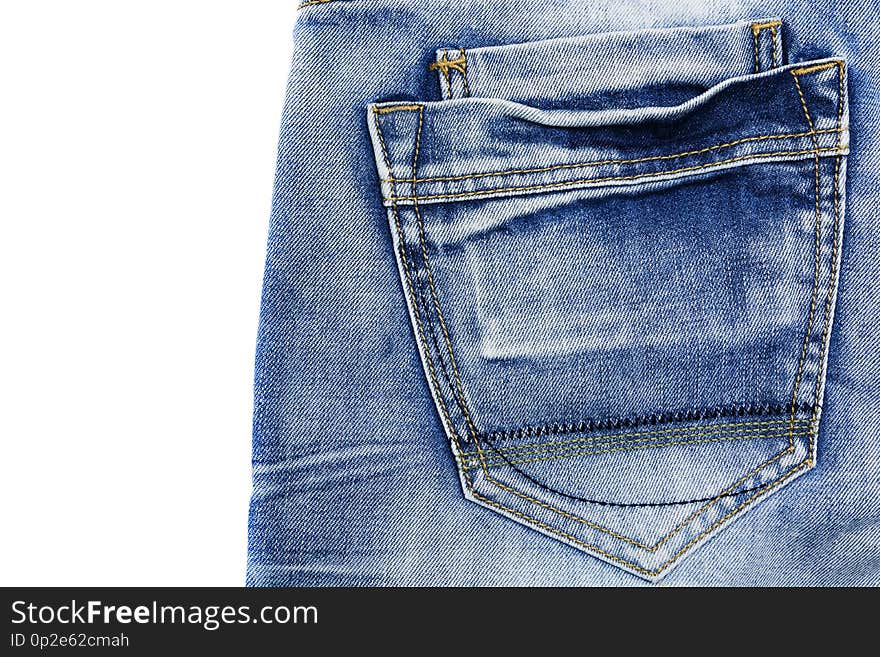 The texture of blue frayed jeans with a pocket on the isolate .Denim background