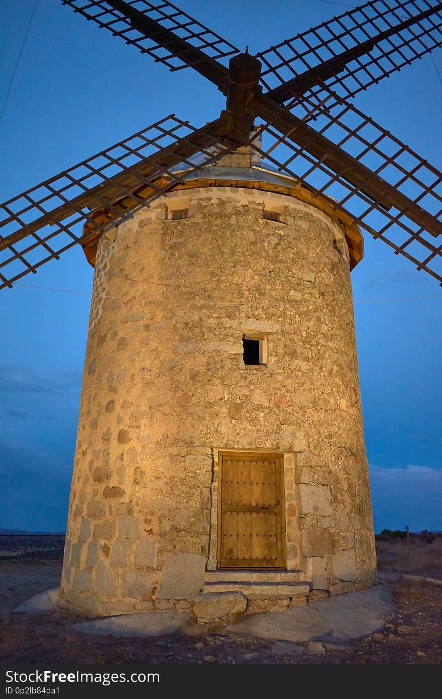 Close-up Windmil at sunset in Las Ventas with Peña Aguilera, Toledo, Spain