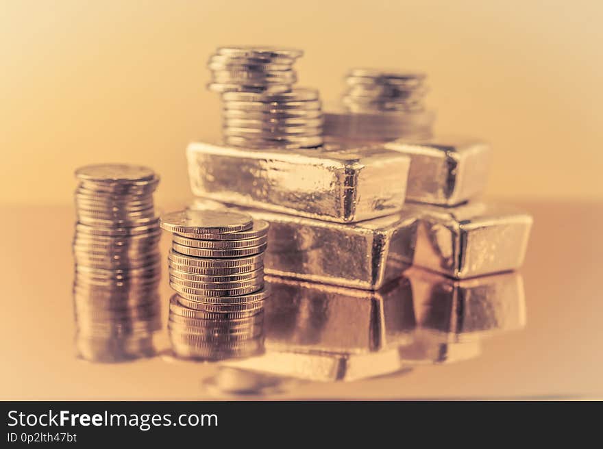 Gold bars and stack of gold coins. Background for finance banking concept. Trade in precious metals.