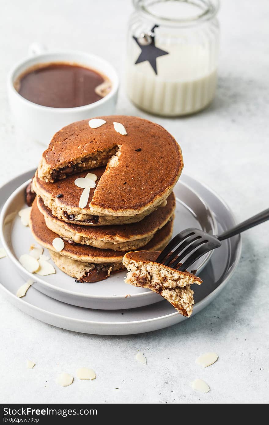 Pancakes stuffed chocolate on gray plate with coffee for breakfast