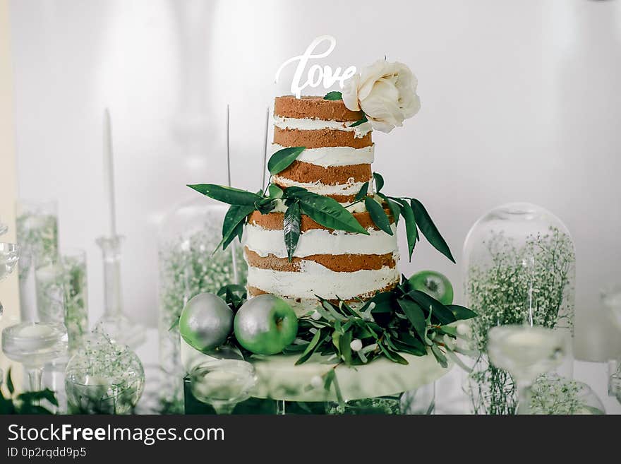 Engagement cake adorned with green leaves and apples. Engagement cake adorned with green leaves and apples