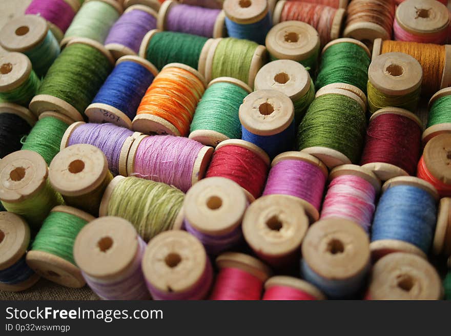 Spools of colored thread. multicolored motley background