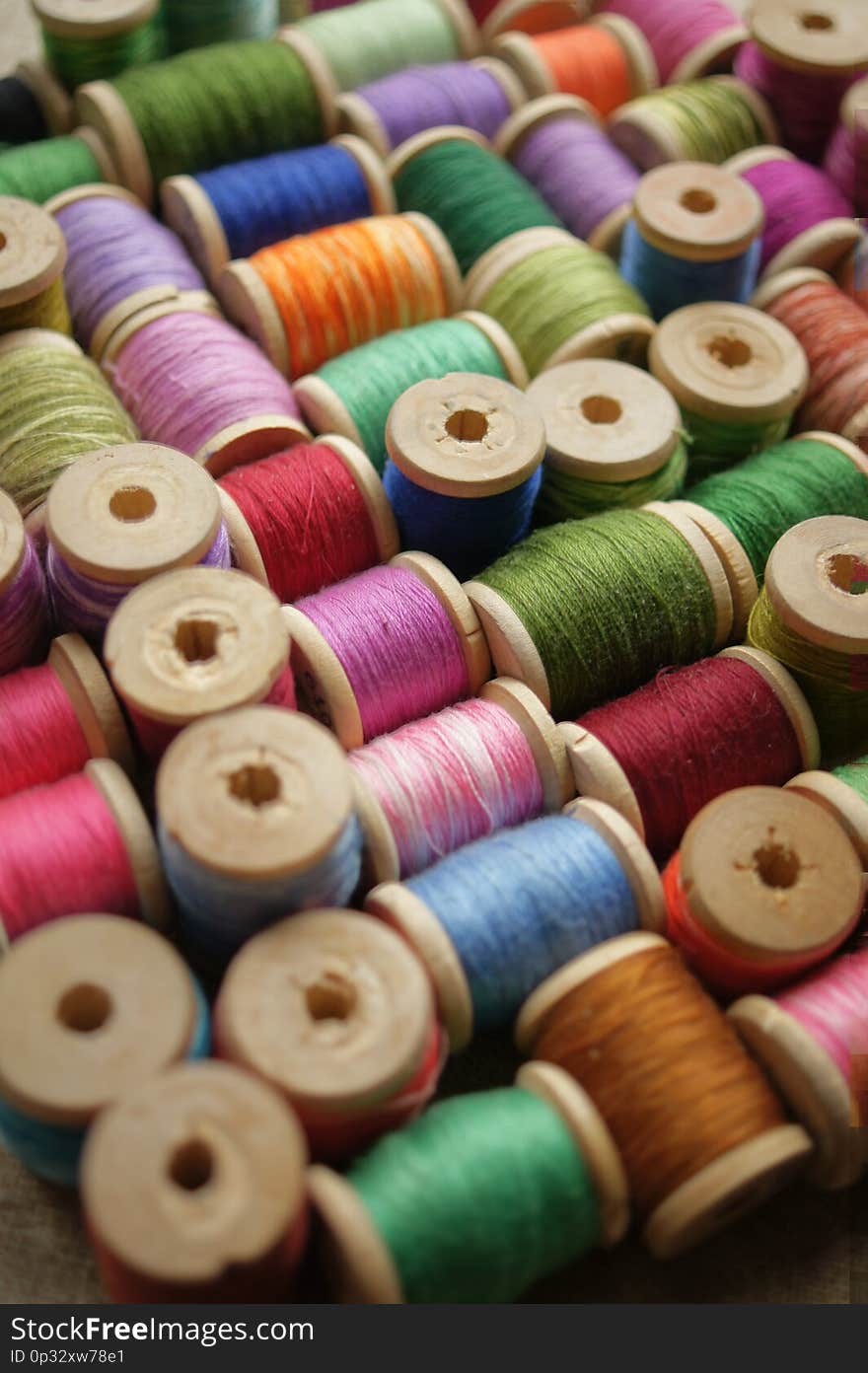 Spools of colored thread. multicolored motley background