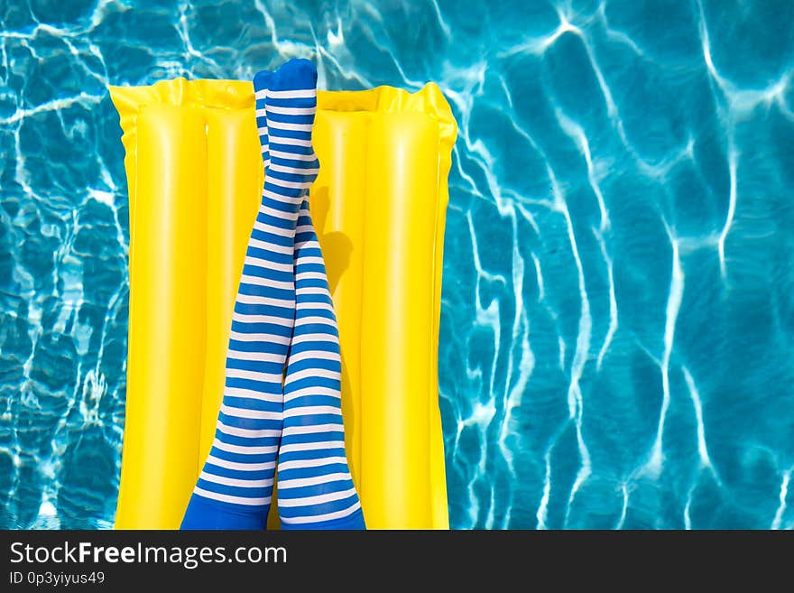 Women Legs Near The Swimming Pool