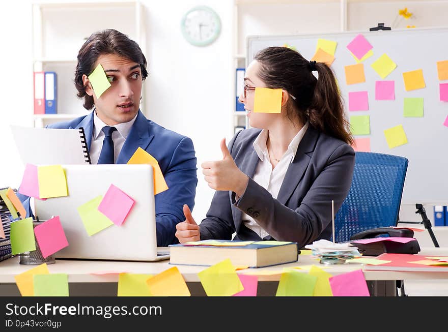 The two colleagues employees working in the office