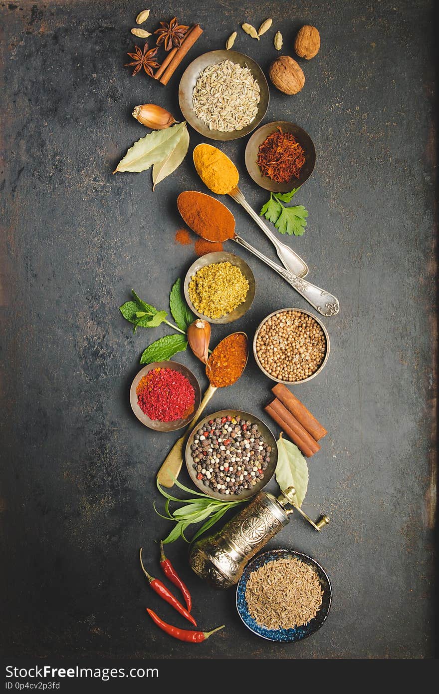 Herbs and spices on dark background