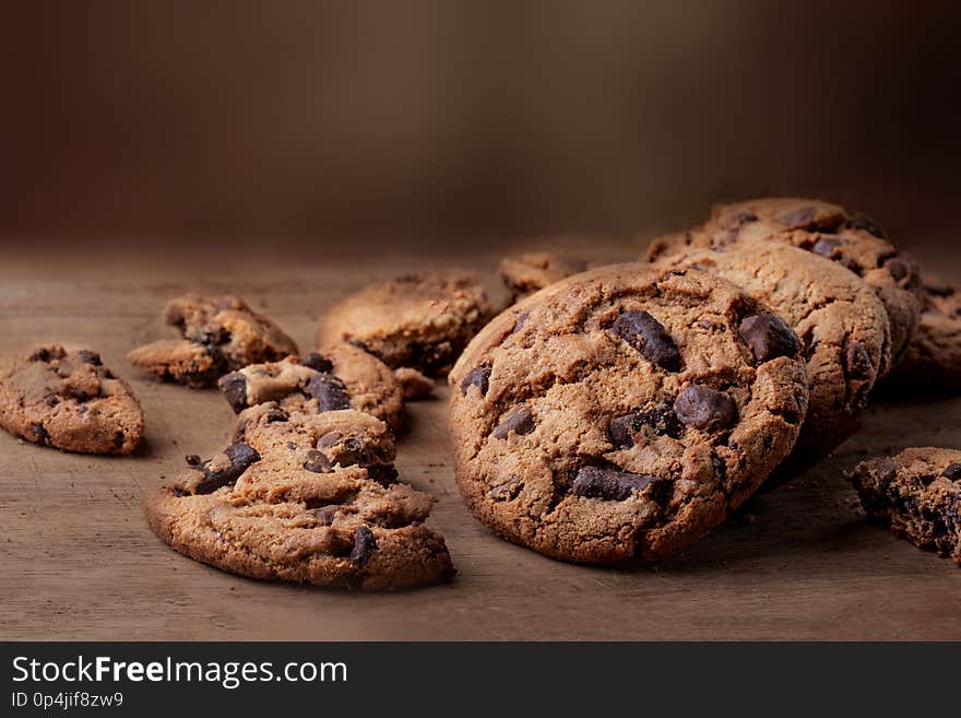 Chocolate chip cookies on wooden Background, copyspace, top view