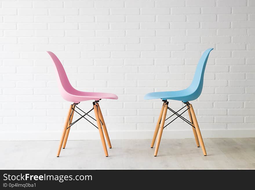 Pair of chairs in pink and blue