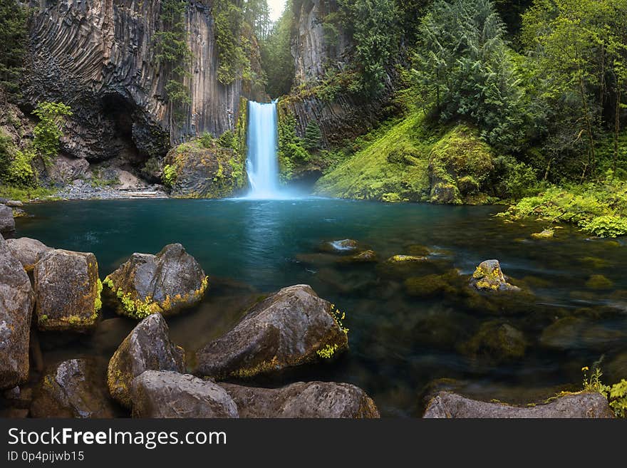 Waterfall mountain view close up. Mountain river waterfall landscape. River scene. Forest waterfall view. Waterfall forest mossy rocks. Summer forest stream view.