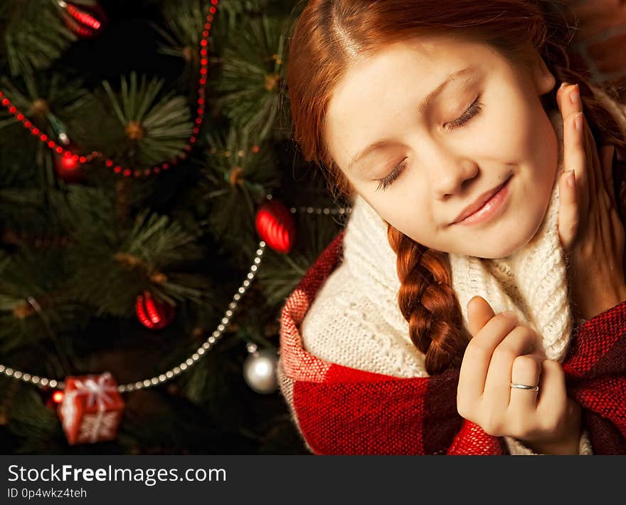 Redhair happy woman with gifts and winter three