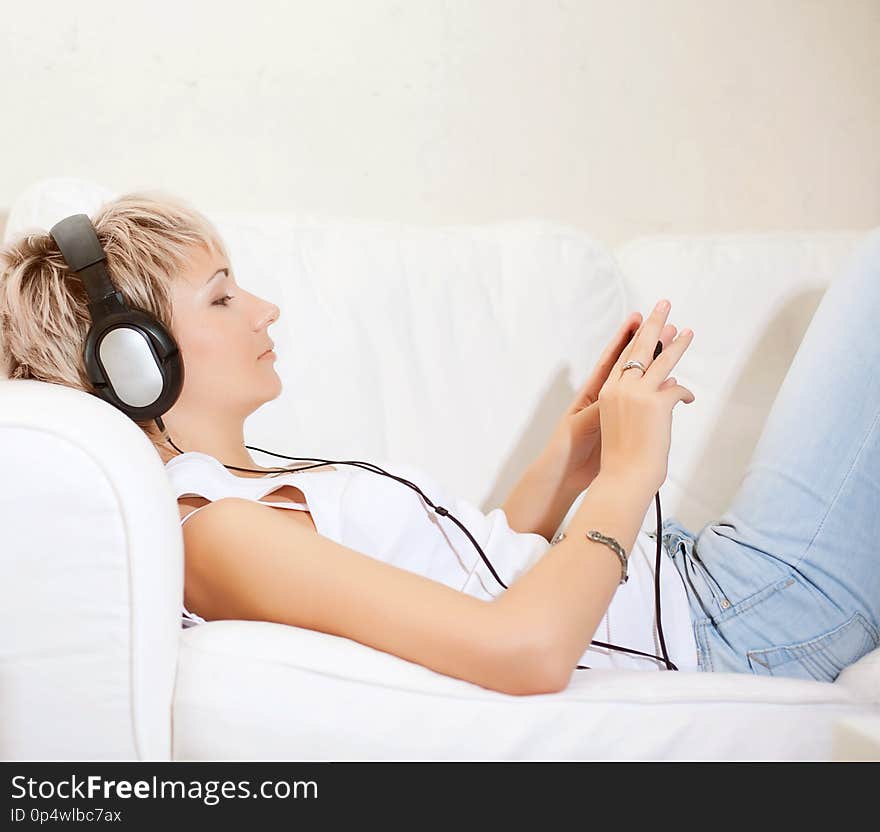 Woman listening to music at home