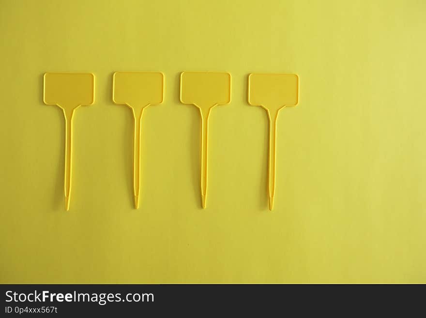 Empty Yellow Labels on a Plain Yellow Background. Empty Yellow Labels on a Plain Yellow Background