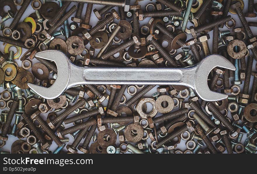 Wrench tool equipment, wrenches on assorted nuts and bolts.