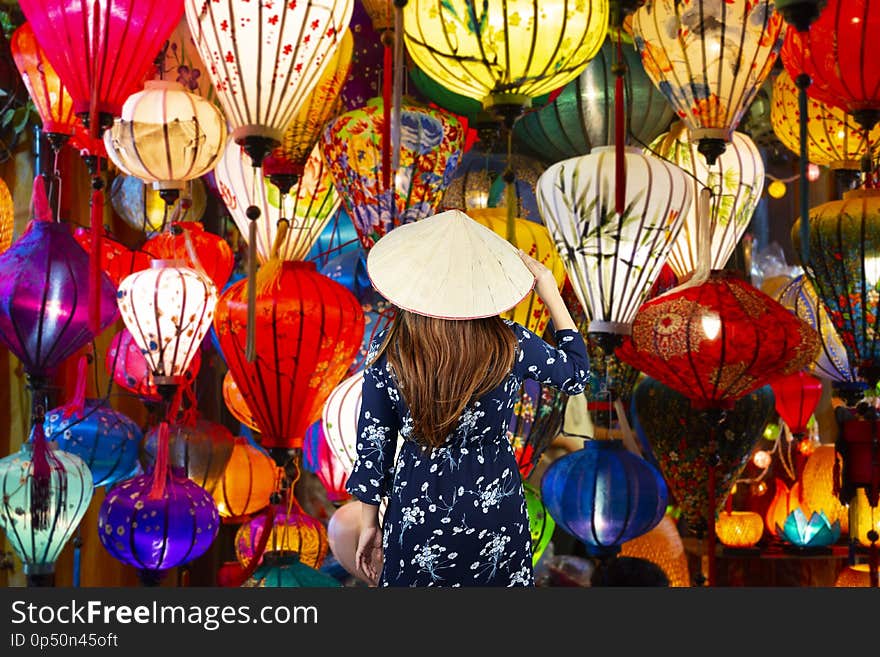 Woman tourist is sightseeing and travel in Hoi An old town famouse place in Vietnam.