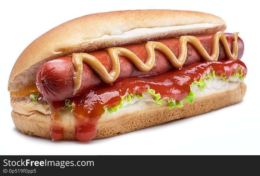 Hot dog - grilled sausage in a bun with sauces isolated on white background