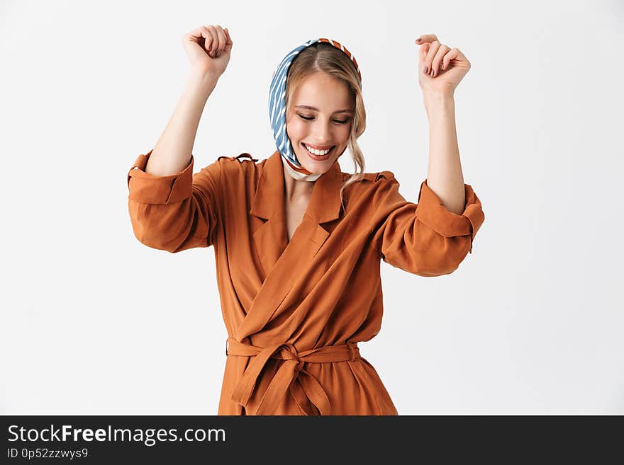 Beautiful young woman wearing silk stylish scarf posing isolated over white wall background dancing