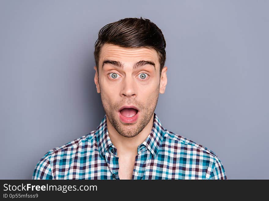 Close up photo amazing he him his man ideal perfect hairstyle styling mouth widely open eyes full fear oh no facial expression wearing casual plaid checkered outfit isolated grey background.