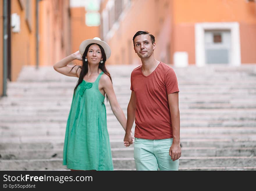 Happy tourist couple, man and woman traveling on holidays in Europe smiling happy. Caucasian couple.