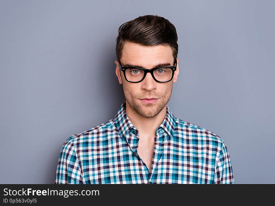 Close up photo attractive amazing macho he him his man guy handsome attentively looking on camera student wearing specs casual plaid checkered shirt outfit isolated grey background.