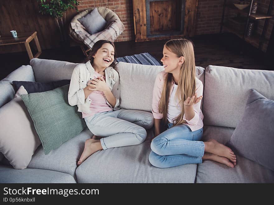 Above high angle view portrait of two nice lovely attractive charming cheerful cheery girls sharing discussing funny