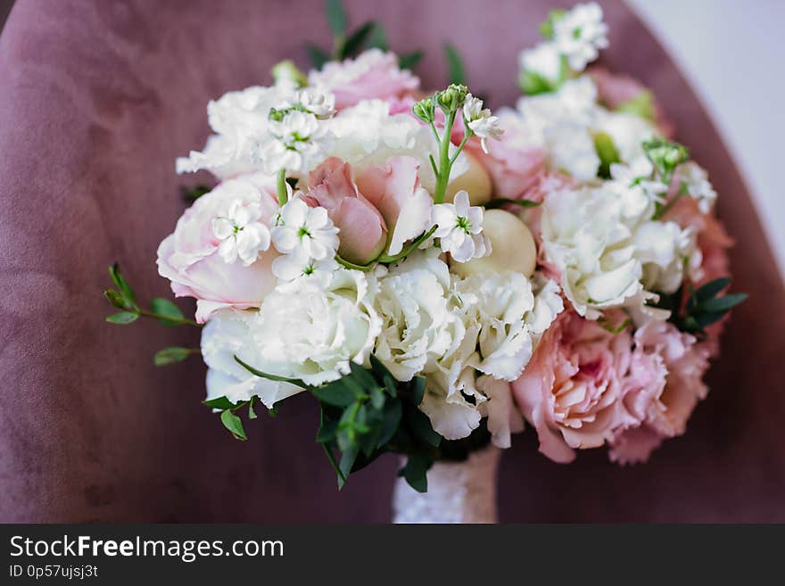 Wedding flowers, bridal bouquet closeup. Decoration made of roses, peonies and decorative plants, close-up, selective focus, nobody, objects