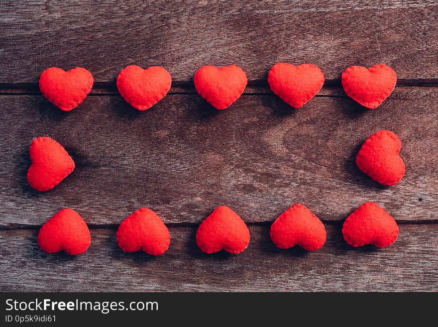 Fabric red heart on wooden background, valentine day concept