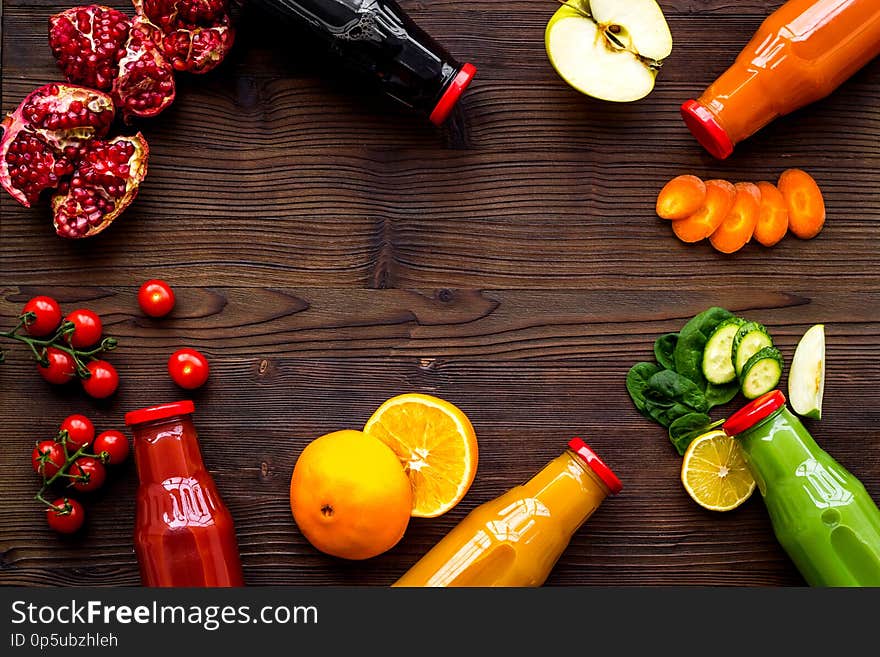 Vegetable and fruit juice in bottles for diet drink on wooden table background top view mock up