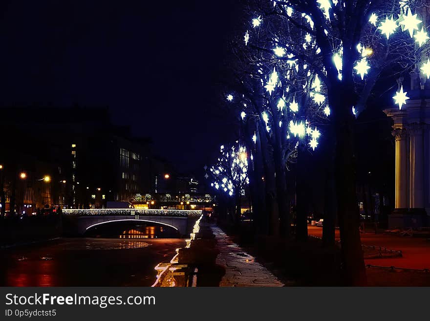 City on Christmas and New Year`s eve. The streets are decorated with illumination. Wonderful holiday atmosphere