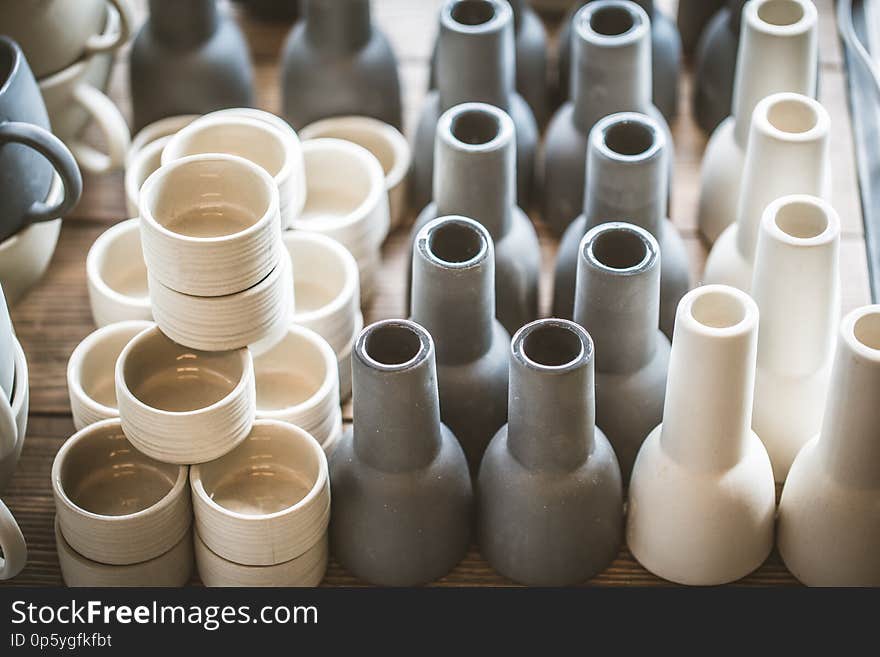 Rustic handmade ceramic clay white cups souvenirs. Street handicraft market container row vintage background brown empty food kitchen pottery abstract clean drink group table bowl design earthenware jar closeup dishware stack beverage many object pattern pots traditional vase beautiful black bottle red style color breakfast coffee restaurant tea antique crockery culture macro nobody retro. Rustic handmade ceramic clay white cups souvenirs. Street handicraft market container row vintage background brown empty food kitchen pottery abstract clean drink group table bowl design earthenware jar closeup dishware stack beverage many object pattern pots traditional vase beautiful black bottle red style color breakfast coffee restaurant tea antique crockery culture macro nobody retro