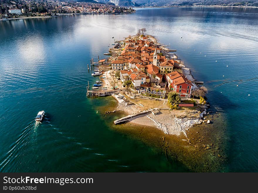 Aerial view of Fishermens Island or Isola dei Pescatori at Lake Maggiore, is one of the Borromean Islands in Piedmont of north Italy, Stresa, Verbania. Aerial view of Fishermens Island or Isola dei Pescatori at Lake Maggiore, is one of the Borromean Islands in Piedmont of north Italy, Stresa, Verbania