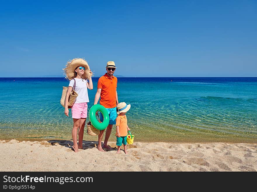 Family on beach, young couple with three year old boy. Sithonia, Greece. Family on beach, young couple with three year old boy. Sithonia, Greece