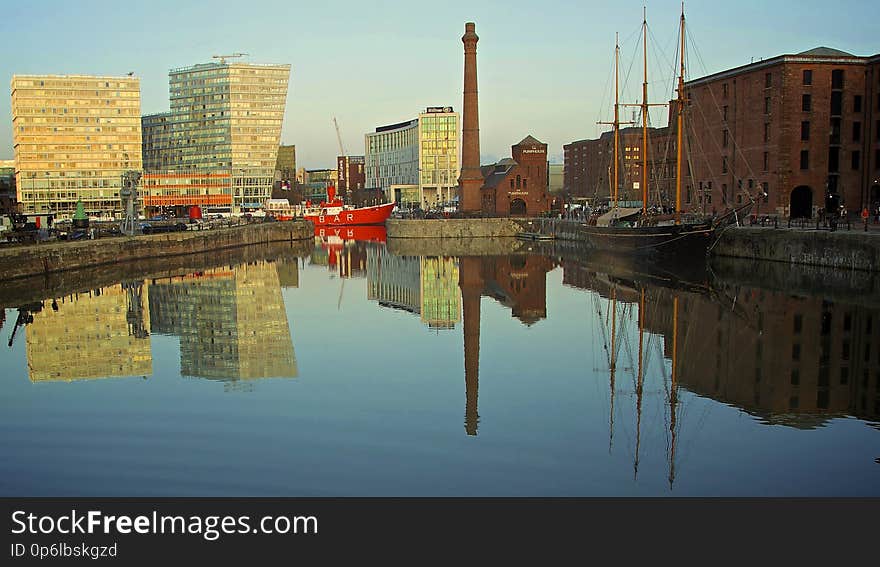 Canning Dock is a dock, on the River Mersey,LIVERPOOL England, and part of the Port of Liverpool. It is situated in the southern dock system, connected to Salthouse Dock to the south and Canning Half Tide Dock to the west. The Canning Graving Docks are accessed from the dock. The dock was opened in 1737 as a protected tidal basin providing an entrance to Old Dock. Having been subsequently enclosed as a wet dock three years earlier, in 1832 it was officially named after the Liverpool MP, George Canning. To the east is the site of Old Dock, built in 1709, which was the world first enclosed commercial dock. Canning Dock would have initially served ships involved in the trans Atlantic slave trade. Access to the northern half of the dock system was via Georges Dock, George&#x27;s Basin and into Princes Dock. In 1899, both Georges Basin and George&#x27;s Dock were filled in and the site is now the Pier Head. Along with the Albert Dock and others in the immediate vicinity, Canning Dock was abandoned as a commercial shipping facility in 1972 due to the rising cost of dredging and falling numbers in traffic. It was restored in the 1980s and provides access to the Canning Graving Docks, which are part of the Merseyside Maritime Museum. LIVERPOOL CITY CENTRE 2012. Canning Dock is a dock, on the River Mersey,LIVERPOOL England, and part of the Port of Liverpool. It is situated in the southern dock system, connected to Salthouse Dock to the south and Canning Half Tide Dock to the west. The Canning Graving Docks are accessed from the dock. The dock was opened in 1737 as a protected tidal basin providing an entrance to Old Dock. Having been subsequently enclosed as a wet dock three years earlier, in 1832 it was officially named after the Liverpool MP, George Canning. To the east is the site of Old Dock, built in 1709, which was the world first enclosed commercial dock. Canning Dock would have initially served ships involved in the trans Atlantic slave trade. Access to the northern half of the dock system was via Georges Dock, George&#x27;s Basin and into Princes Dock. In 1899, both Georges Basin and George&#x27;s Dock were filled in and the site is now the Pier Head. Along with the Albert Dock and others in the immediate vicinity, Canning Dock was abandoned as a commercial shipping facility in 1972 due to the rising cost of dredging and falling numbers in traffic. It was restored in the 1980s and provides access to the Canning Graving Docks, which are part of the Merseyside Maritime Museum. LIVERPOOL CITY CENTRE 2012