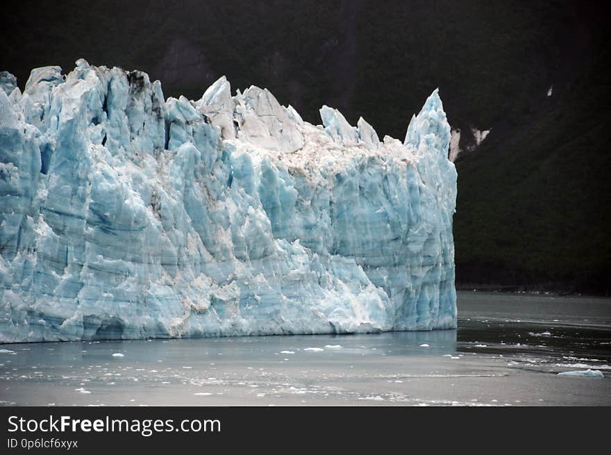 The longest source for Hubbard Glacier originates 122 kilometres &#x28;76 mi&#x29; from its snout and is located at about 61°00′N 140°09′W, approximately 8 kilometres &#x28;5 mi&#x29; west of Mount Walsh with an altitude around 11,000 feet &#x28;3,400 m&#x29;. A shorter tributary glacier begins at the easternmost summit on the Mount Logan ridge at about 18,300 feet &#x28;5,600 m&#x29; at about 60°35′0″N 140°22′40″W. Before it reaches the sea, Hubbard is joined by the Valerie Glacier to the west, which, through forward surges of its own ice, has contributed to the advance of the ice flow that experts believe will eventually dam the Russell Fjord from Disenchantment Bay waters. The longest source for Hubbard Glacier originates 122 kilometres &#x28;76 mi&#x29; from its snout and is located at about 61°00′N 140°09′W, approximately 8 kilometres &#x28;5 mi&#x29; west of Mount Walsh with an altitude around 11,000 feet &#x28;3,400 m&#x29;. A shorter tributary glacier begins at the easternmost summit on the Mount Logan ridge at about 18,300 feet &#x28;5,600 m&#x29; at about 60°35′0″N 140°22′40″W. Before it reaches the sea, Hubbard is joined by the Valerie Glacier to the west, which, through forward surges of its own ice, has contributed to the advance of the ice flow that experts believe will eventually dam the Russell Fjord from Disenchantment Bay waters.